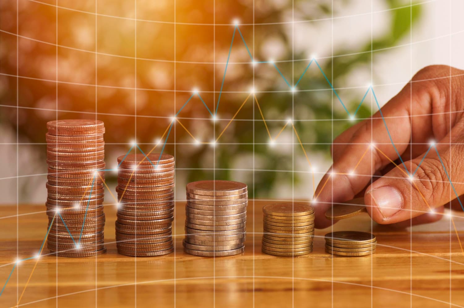 Growing coin stacks representing margin money financial support